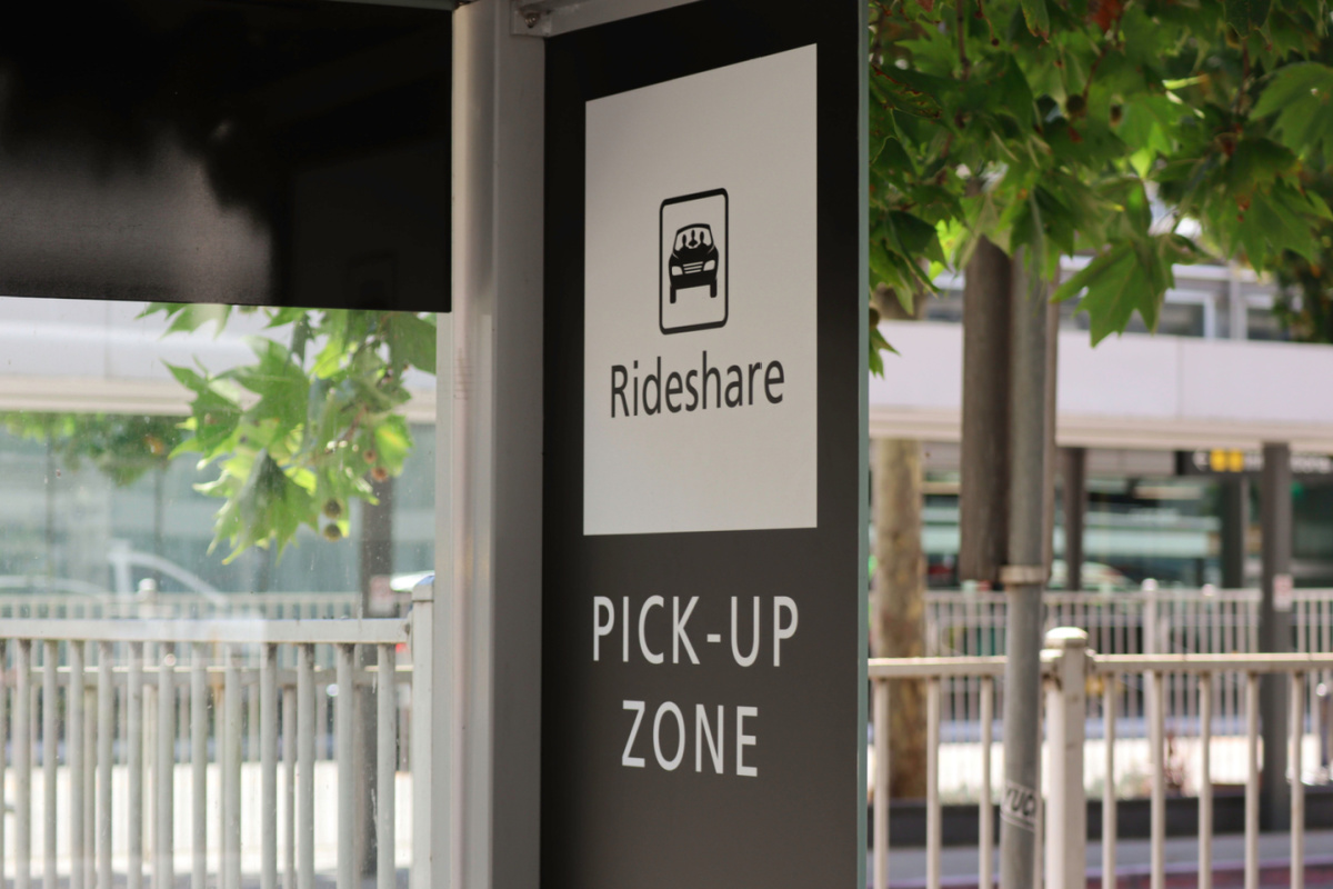 Ride share sign with a picture of a car in a box.